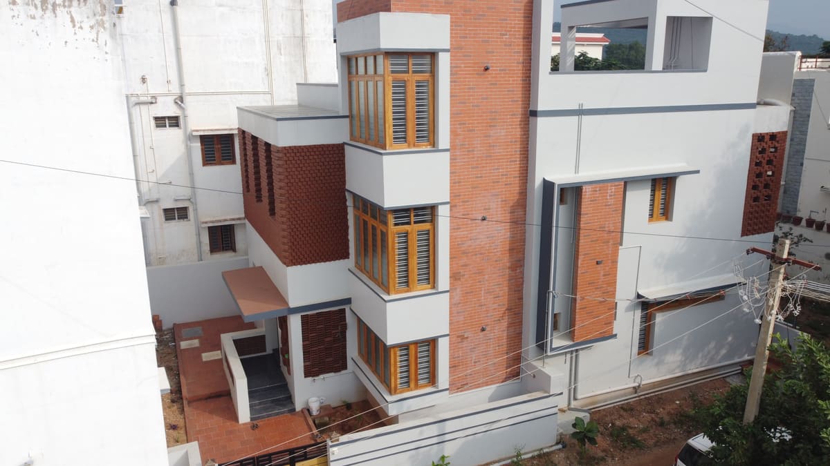 Brick Facade House, Aundipatti — a completed Poriyaalan home